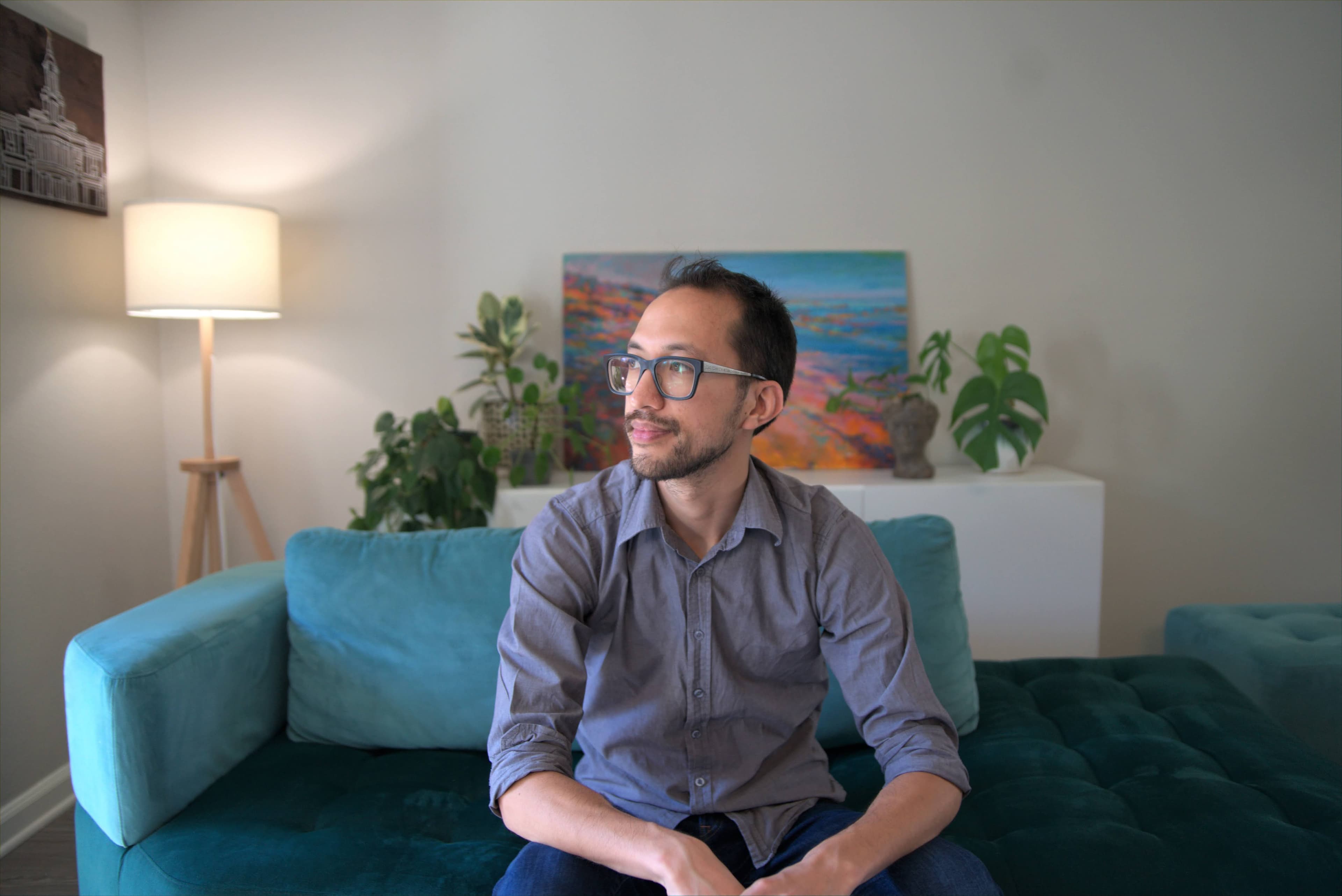 Daniel looking to the left with a relaxed smile.