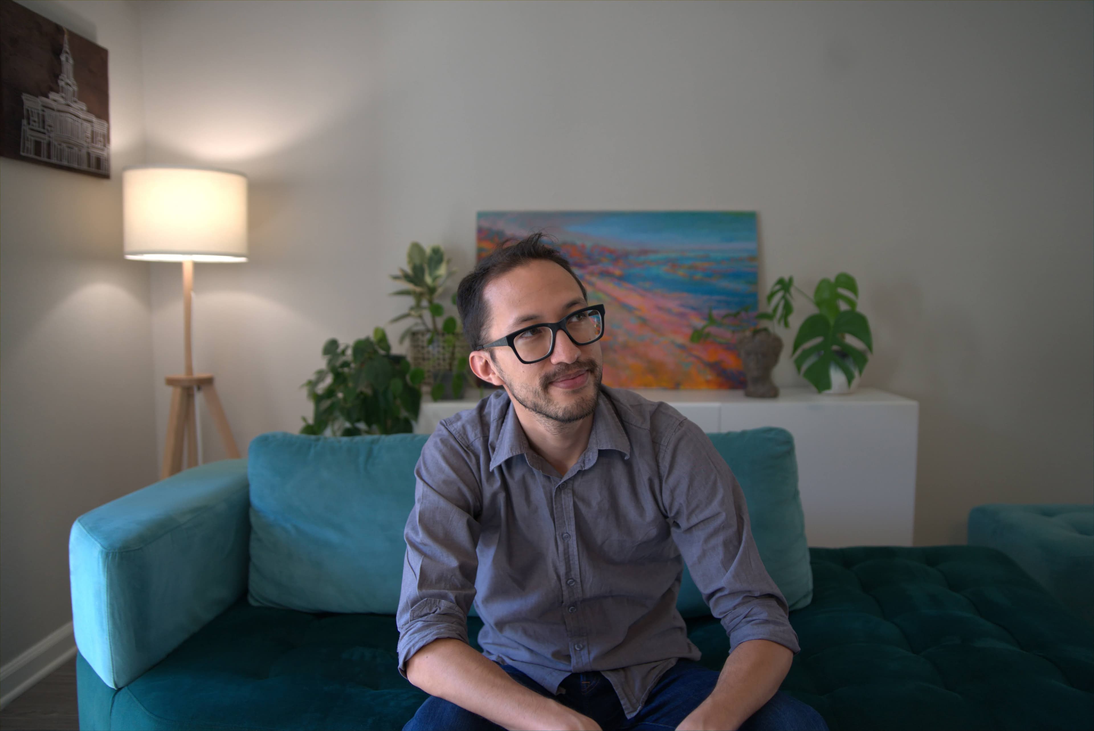 Daniel looking to the right with a thoughtful smile.